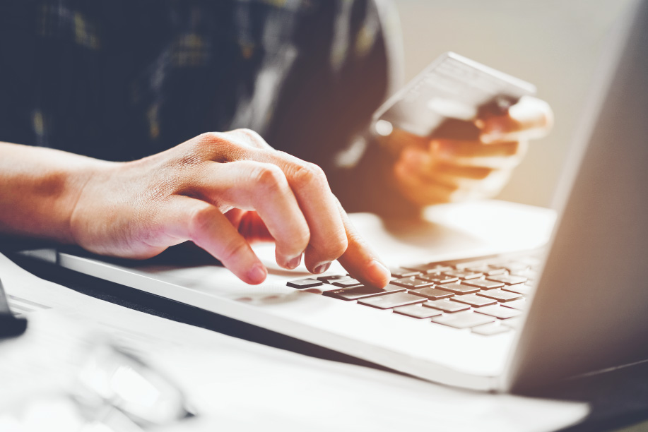 entering card information on laptop